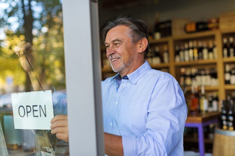 Retail wine shop owner happy with his marketing strategy